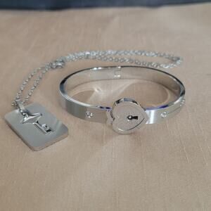 Stainless steel locking silver bracelet with key necklace and heart shape lock